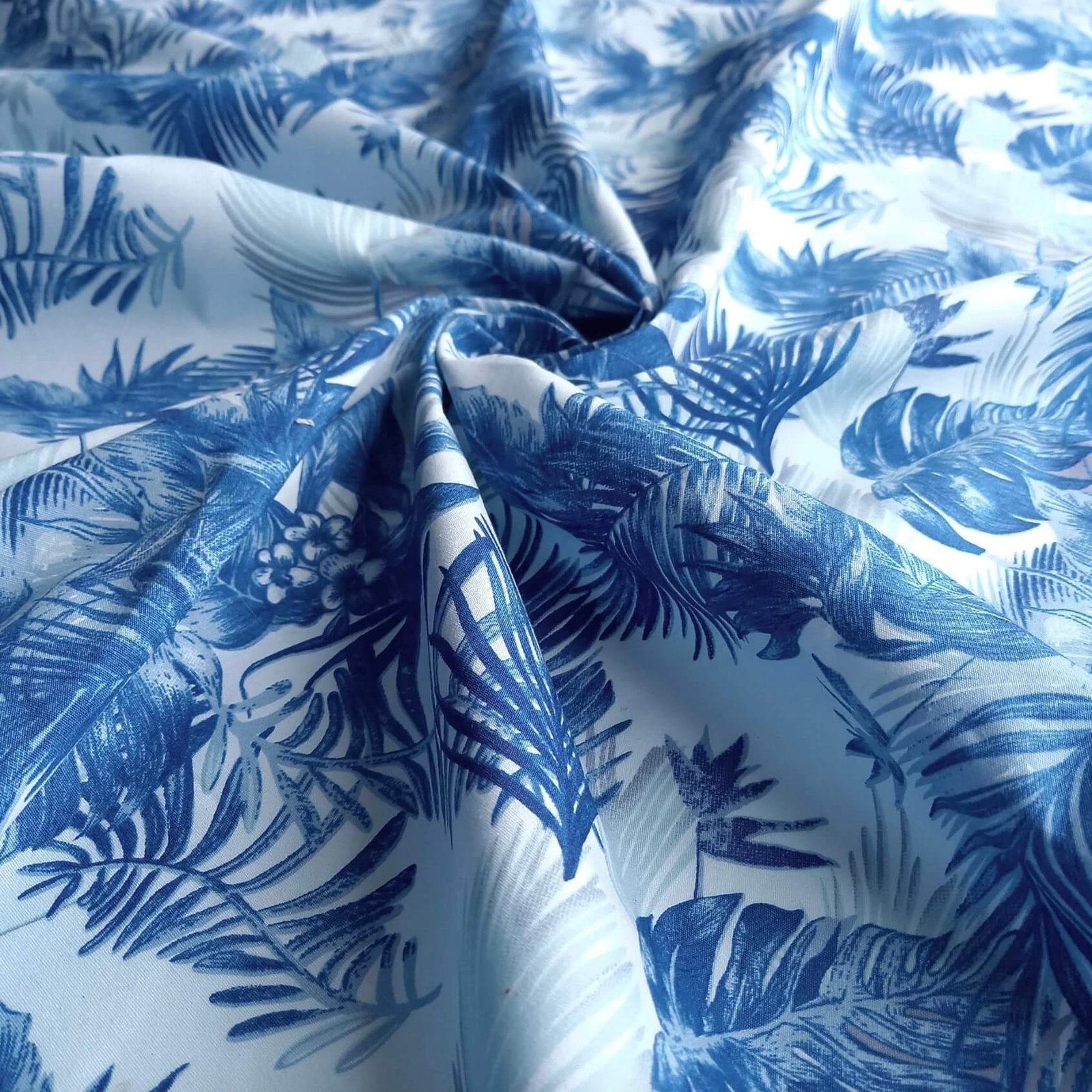 Bright tropical leaf pattern on upholstery.