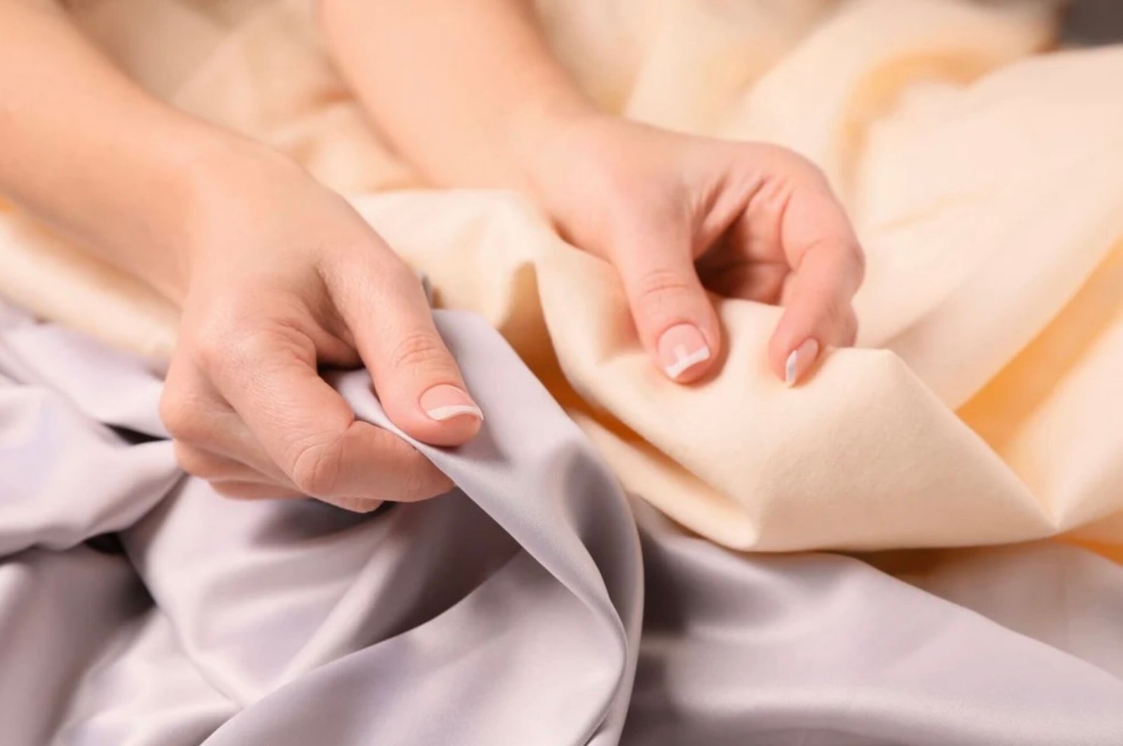 Inspector examining fabric with a magnifying glass