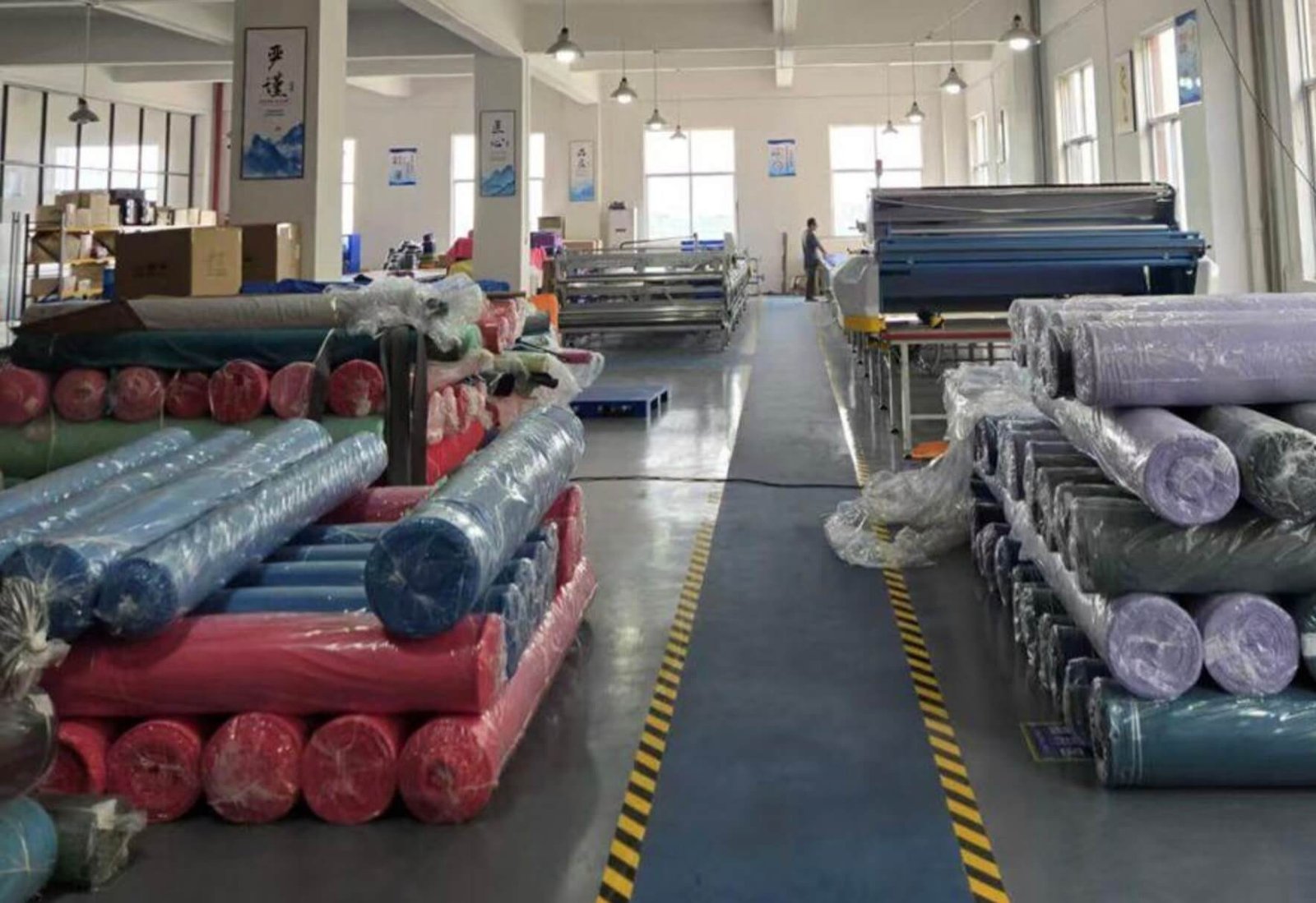 Organized warehouse with rolls of textiles